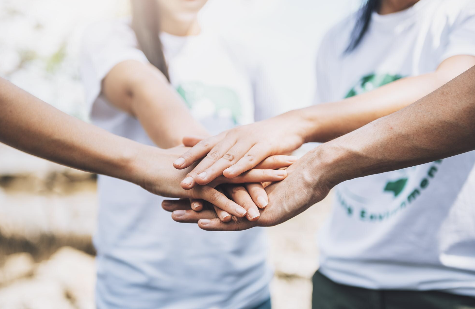 Team coming together to show nonprofit support